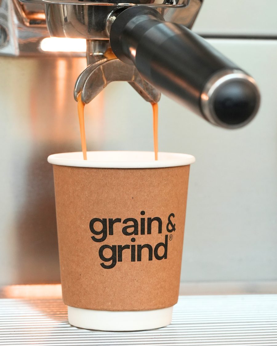Espresso pouring into a Grain & Grind cup